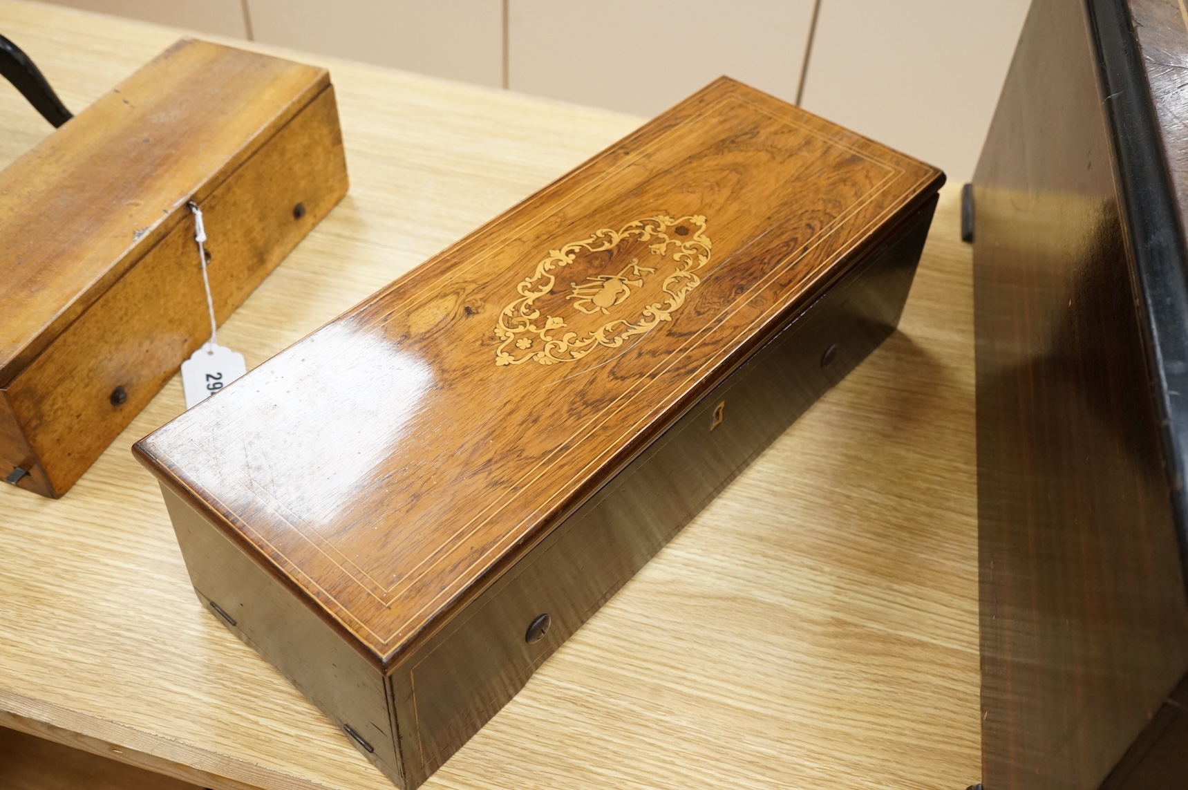 A mid 19th century Nicole Freres key wound cylinder musical box in an inlaid rosewood case, playing on approx 105 tooth comb, cylinder 27.5cm long, stamped ‘Nicole Frere a Geneve’, 26927, with key, the case; 45.5cm wide,